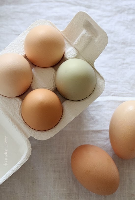 Fresh farm eggs of varied color.
