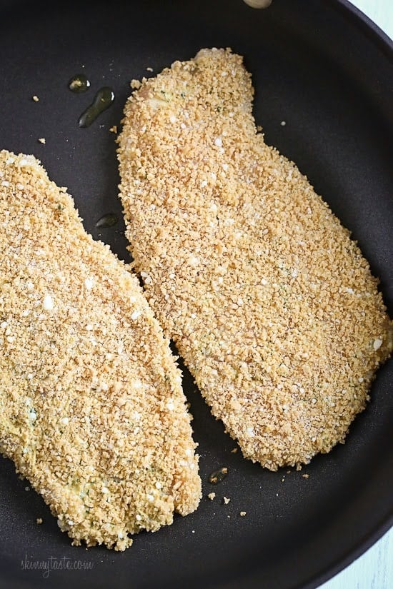 Mustard Herb Crusted Chicken Breasts Mustard Herb Crusted Chicken Breasts cooking on a pan.