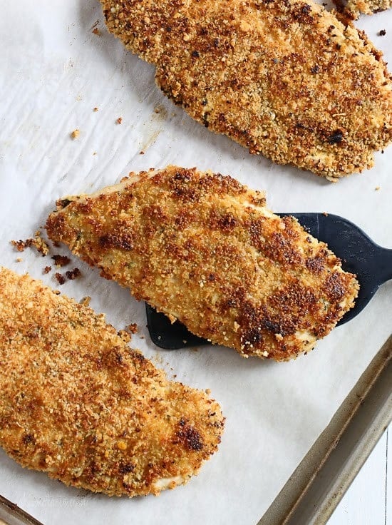 Mustard Herb Crusted Chicken Breasts Mustard Herb Crusted Chicken Breasts on a tray.
