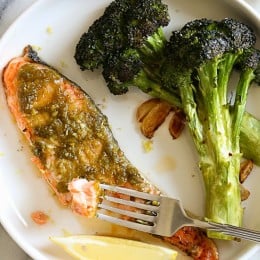 Harissa is one of my go-to sauces for adding a quick burst flavor to any ingredient. You can put it on veggies, meats, seafood, and eggs and even use it as a dipping sauce. For this recipe, I literally just smothered the harissa on top of the salmon with a little lemon zest and put it in the oven.