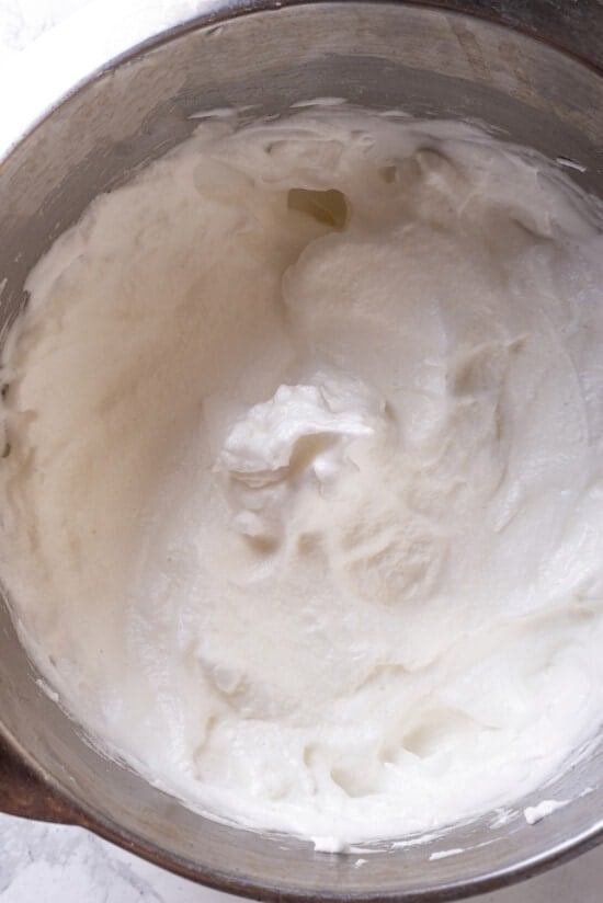 This easy almond cake recipe is made with just 5 ingredients but don't let its simplicity fool you—it's light, airy, and so delicious! Egg whites in bowl after beating