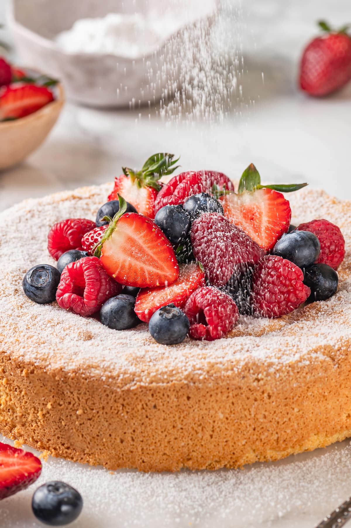 This easy almond cake recipe is made with just 5 ingredients but don't let its simplicity fool you—it's light, airy, and so delicious! Dusting almond cake with powdered sugar