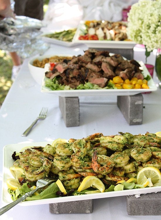 Seafood and steak on a platter on a table.