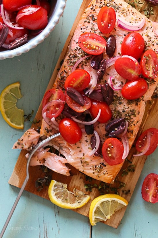 Grilled wild Mediterranean cedar plank salmon topped with tomatoes, kalamata olives and red onion.