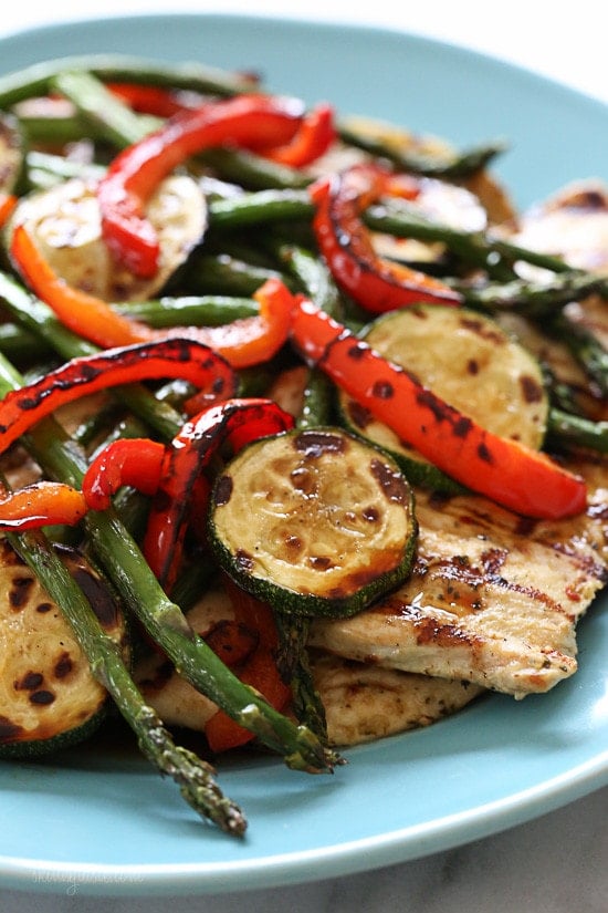 Grilled chicken breast, zucchini, red peppers and asparagus topped with a honey balsamic dressing – this is SO good, I know you'll be making this all summer and nothing beats an easy summer dish made entirely on the grill so you don't have to heat up your kitchen!