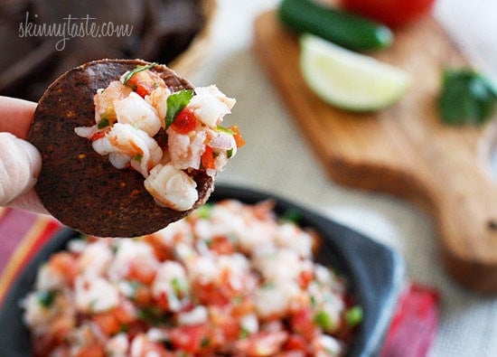 Skinny Shrimp Salsa is so good, you might not want to share! Made with shrimp, tomatoes, cilantro, red onion and lime juice. Bring this to a party and watch it disappear!
