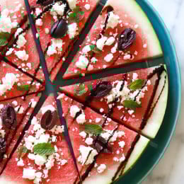 This savory Watermelon "Pizza" with Feta and Balsamic is delicious, refreshing and makes a fun summer salad or side dish with anything you're grilling!