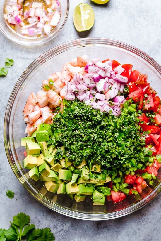 Zesty Lime Shrimp and Avocado Salad, a light and refreshing salad that requires no cooking! Lime juice and cilantro are the key ingredients to creating this wonderful, healthy salad you'll want to make all summer long.