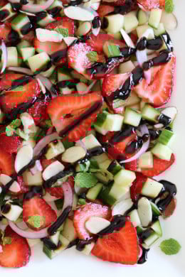This easy light summer salad, made with cucumbers, strawberries, almonds and fresh herbs is great alongside grilled chicken, fish or for a light lunch you can double the serving and add some goat cheese to the mix or serve it over quinoa for more protein.