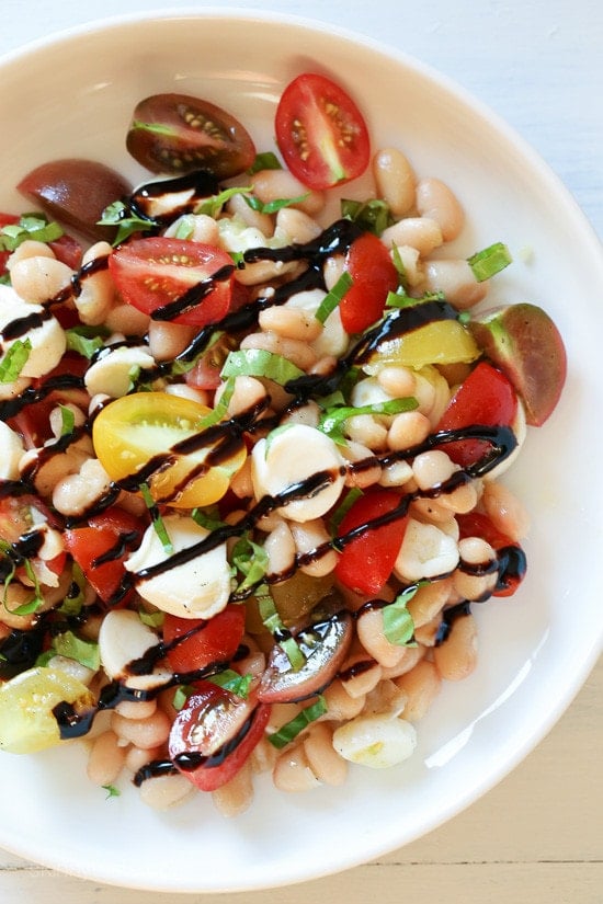White Bean Caprese Salad Nothing says summer like a Caprese salad, and this one is made with white beans for added protein and fiber. It's EASY to make, and there's no cooking required which is a bonus during these hot summer temperatures we're having this week.