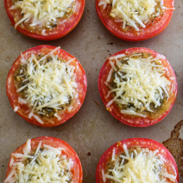 Pesto Parmesan Baked Tomatoes are delicious roasted tomatoes topped with pesto and shredded Parmesan cheese. So easy to make, only 3 ingredients!