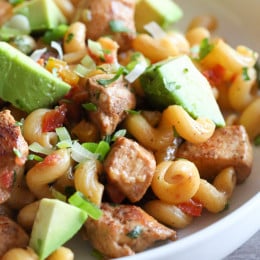 A Mexican-inspired pasta dish... Chicken fajitas meets pasta night! This easy chicken dinner is made in one pot, for an easy dinner ready in under 30 minutes!
