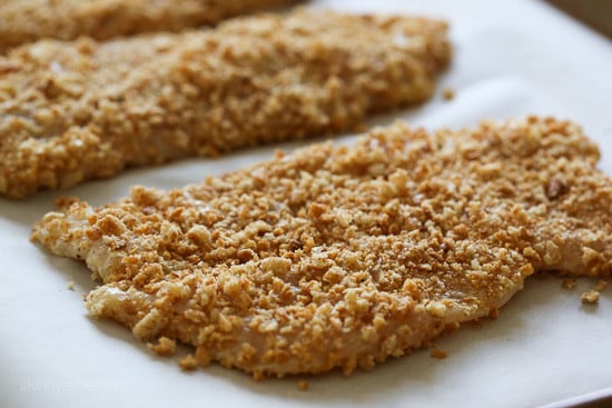 Encrusted chicken ready to be baked.
