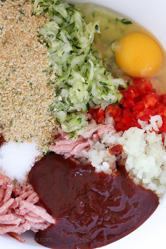 These EASY Bacon Topped Petite Turkey Meatloaf with BBQ Sauce are so moist with the addition of grated zucchini to the meatloaf mix!