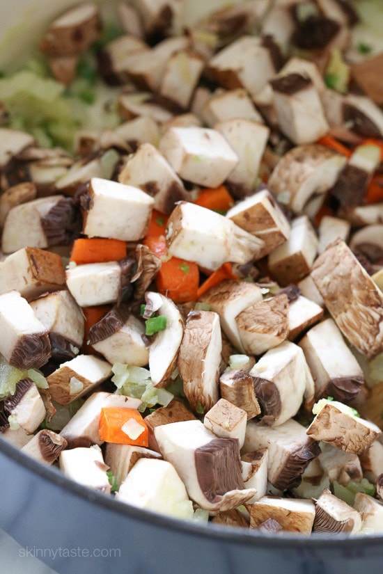 This Vegetarian Pumpkin Chili is loaded with pumpkin puree, veggies, beans, and a homemade spice blend. Hearty, filling, and oh-so-tasty! Mushrooms and carrots in a pot