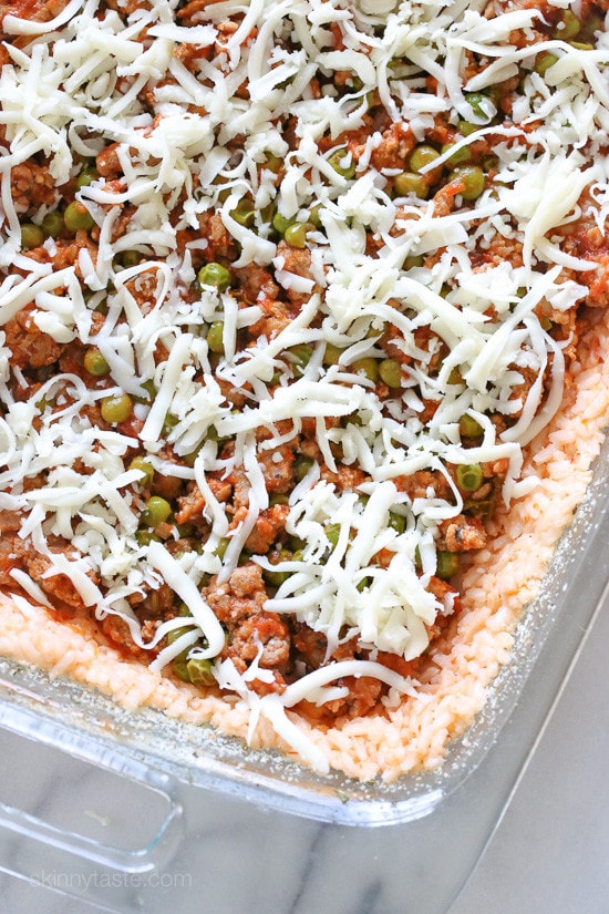 Sicilian Rice Ball Casserole filled with ground turkey and a little sausage adds lots of flavor, plus peas and sauce. Freezes well, great for potlucks and family friendly!