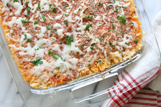 Sicilian Rice Ball Casserole filled with ground turkey and a little sausage adds lots of flavor, plus peas and sauce. Freezes well, great for potlucks and family friendly!