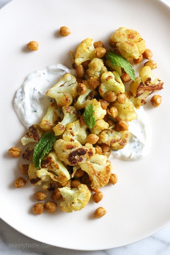 In an effort to still enjoy the flavors yet lighten things up a bit, I decided to create this roasted cauliflower and chickpea dish with minty yogurt. It’s great for lunch or as a side dish with dinner.