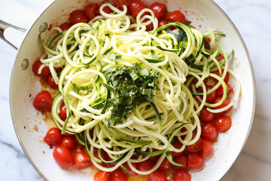 Chicken and Zucchini Noodle Caprese is made with sauteed bite-sized chicken breast and grape tomatoes cooked with spiralized zucchini, fresh mozzarella and basil. An easy, low-carb 30-minute meal!