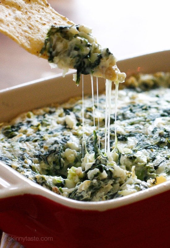 Hot Spinach and Artichoke Dip This easy, cheesy, Hot Spinach Artichoke Dip will be a hit at your next party, no one will know it's light!