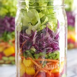 This colorful Asian-inspired salad is layered with edamame, bell peppers, carrots, snow peas, cabbage and lettuce and a simple sesame-soy vinaigrette. One jar is a huge serving, perfect for lunch or it can serve two as a side dish.