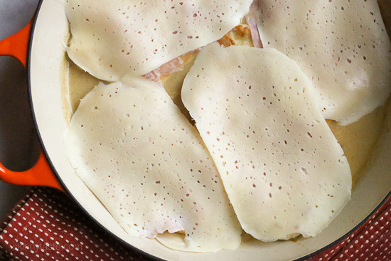 This EASY Skillet Chicken Cordon Bleu recipe is made with thin sliced boneless chicken cutlets, lightly pan fried then topped with ham and Swiss in a light Lemon-Dijon Sauce. No rolling!