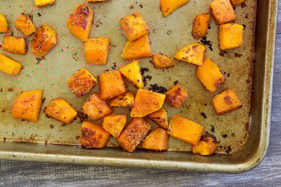A baking sheet with roasted cubed butternut squash