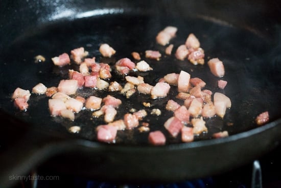 This Spring breakfast hash recipe is made with a combination of sauteed asparagus, diced Yukon gold potatoes, pancetta and shallots then topped with an egg.