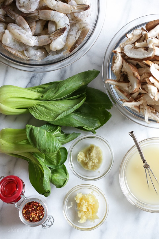 Raw ingredients of garlicky shrimp stir-fry with shiitakes and bok choy.