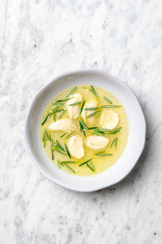 With fragrant rosemary and garlic, this easy grilled lamb chops recipe is flavorful, succulent, and one I love to cook all year long! Overhead view of garlic rosemary marinade for lamb chops in bowl