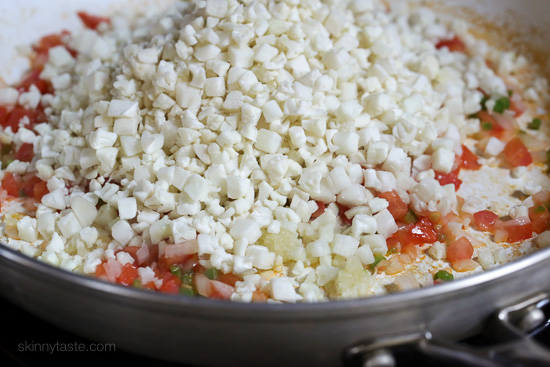 This Mexican inspired dish of Cauliflower "Rice" uses finely chopped cauliflower, which makes a fantastic low-carb, grain-free stand in for rice. You can season it many different ways, here I sauteed sauteed it with tomatoes, onions, jalapeno and spices.