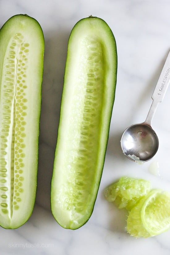 Cucumbers with the seeds scooped out and filled with hummus, avocado, tomatoes, onion and sprouts. So refreshing, healthy and light!