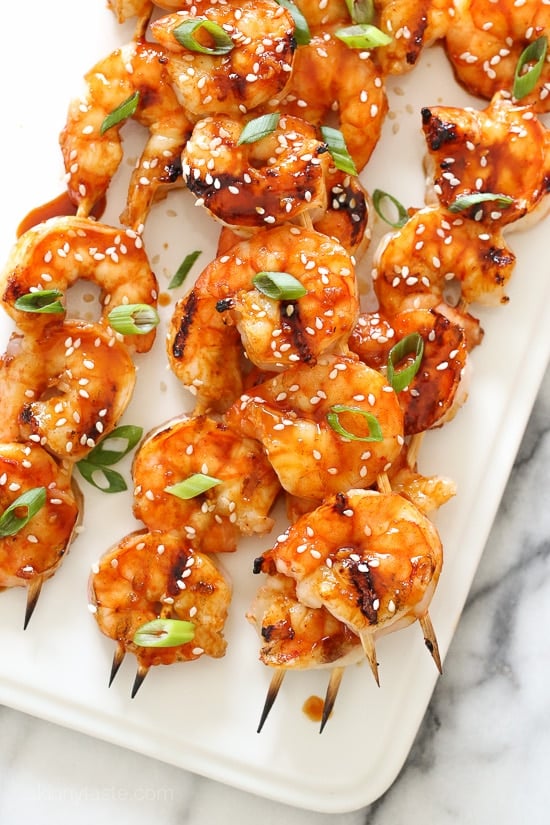Sweet and spicy Korean-inspired Gochujang-Honey Glazed Shrimp Skewers are perfect for weeknight cooking because they take less than 10 minutes to cook.