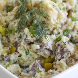 This creamy potato salad made with rainbow potatoes, celery, pickles, mustard and dill is lightened up using half mayonnaise, half yogurt. Perfect for picnics and backyard parties all summer long.