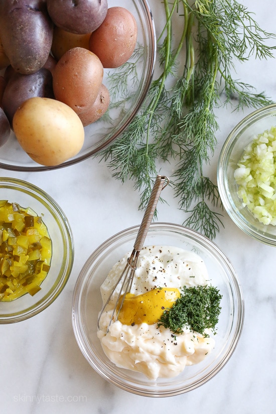 This creamy potato salad made with rainbow potatoes, celery, pickles, and dill is lightened up using half mayonnaise, half yogurt. Perfect for picnics and backyard parties all summer long.