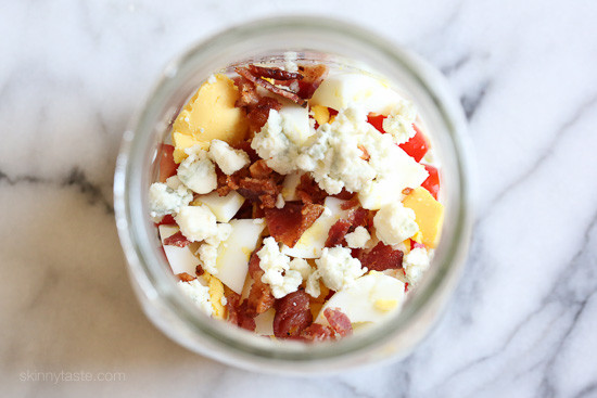 tomato, egg, cheese and bacon in mason jar