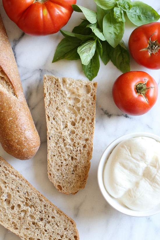 I've been taking advantage of the tomatoes and basil overflowing from my garden with these simple French bread pizzas. Less than 15 minutes to make, you can have them for lunch or dinner paired with a side salad.