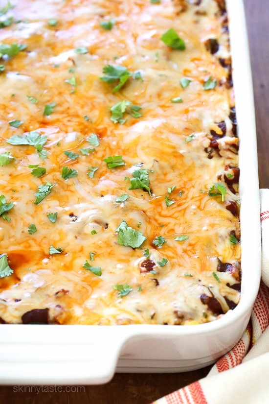 Late Summer Vegetable Enchilada Pie – A saucy, lasagna-like Mexican-American casserole layered with vegetables, tortillas, sauce and cheese.