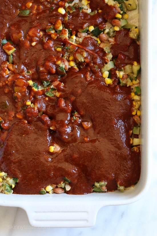 Late Summer Vegetable Enchilada Pie – A saucy, lasagna-like Mexican-American casserole layered with vegetables, tortillas, sauce and cheese.