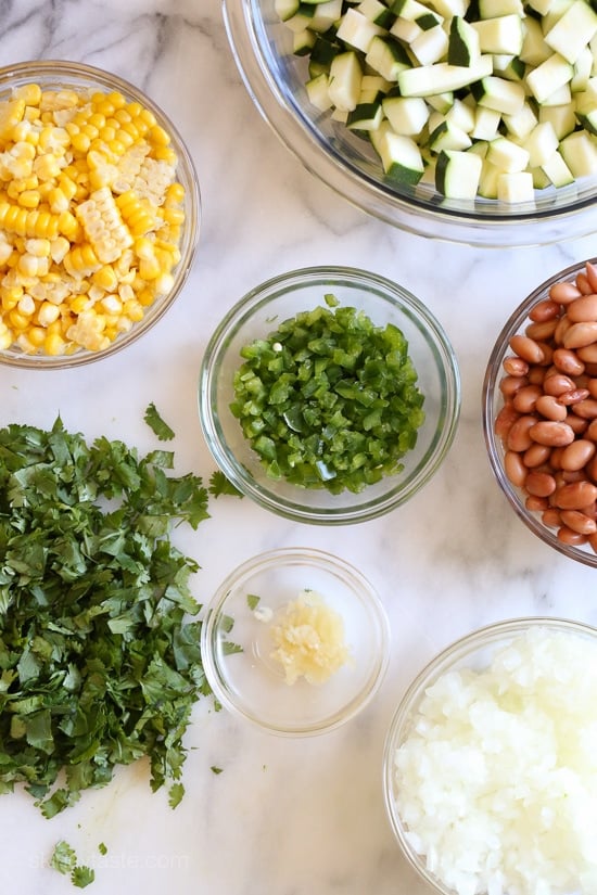 Late Summer Vegetable Enchilada Pie – A saucy, lasagna-like Mexican-American casserole layered with vegetables, tortillas, sauce and cheese.
