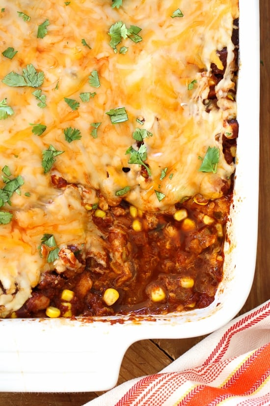 Late Summer Vegetable Enchilada Pie – A saucy, lasagna-like Mexican-American casserole layered with vegetables, tortillas, sauce and cheese.