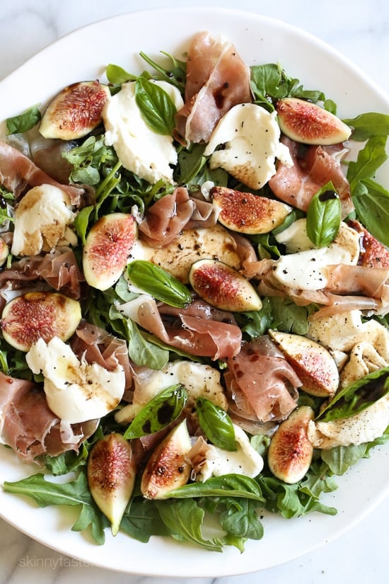 Figs and Prosciutto, savory and sweet they're a match made in heaven! Add some fresh mozzarella, peppery arugula and balsamic dressing and this salad will make you swoon with every bite.