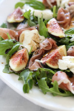 Figs and Prosciutto, savory and sweet they're a match made in heaven! Add some fresh mozzarella, peppery arugula and balsamic dressing and this salad will make you swoon with every bite.