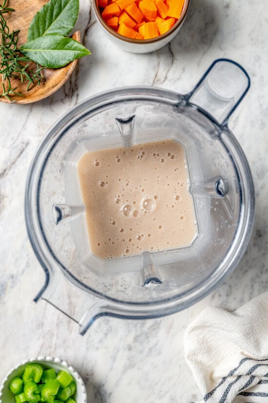 This delicious, hearty navy bean soup is inexpensive and easy to make! Cook it on the stovetop, or in your Instant Pot or slow cooker. Pureed beans in blender