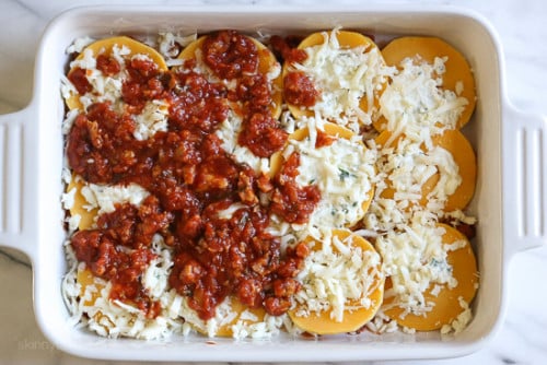 This fall lasagna swaps pasta for butternut squash layered with a chicken sausage meat sauce, ricotta, and mozzarella. Simply wonderful, you won't miss the pasta!