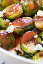 These Brussels sprouts start in the skillet and finish in the oven for perfectly charred edges, then drizzled with buffalo hot sauce and crumbled blue cheese – SO good!!