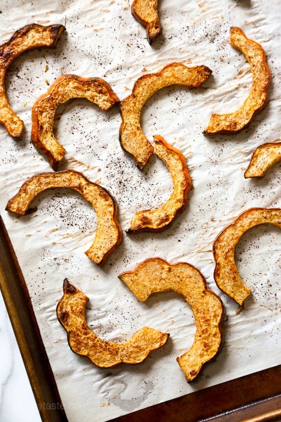 Roasted winter squash, pomegranates and pecans over massaged kale with a light maple balsamic dressing – there is nothing boring about this salad! Rubbing the raw kale with olive oil for a few minutes leaves it tender and takes away the bitterness.