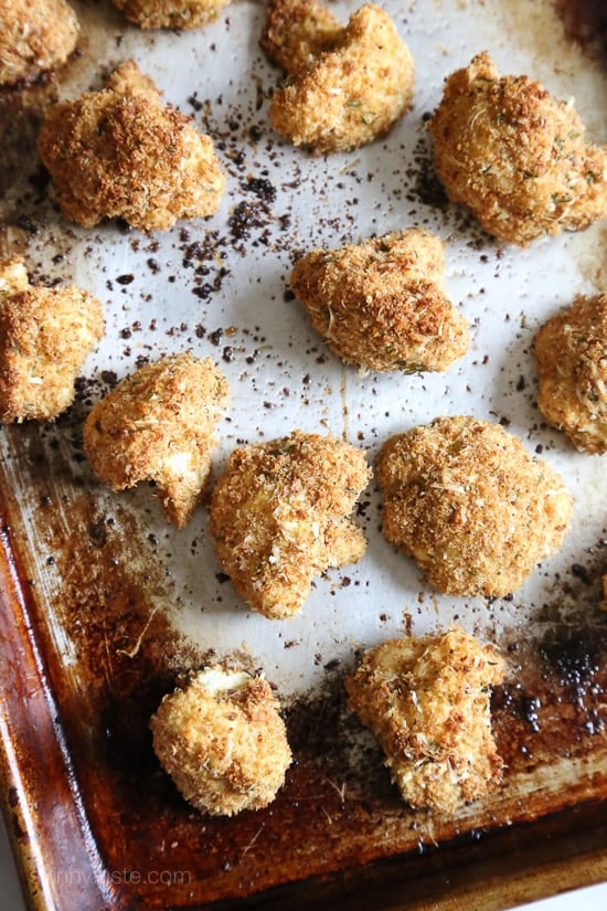 These delicious breaded cauliflower florets are baked in the oven with a parmesan-crumb crust, they remind me of my Moms fried cauliflower I used to love as a kid – without all the frying!