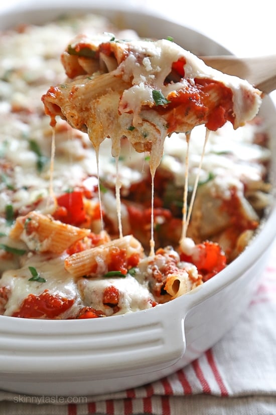 Penne baked with cheese, sauce and loaded with healthy vegetables in every bite. Roasted zucchini, red bell peppers, asparagus, red onion and fennel are tossed with balsamic and herbs then roasted for the best tasting meatless baked pasta dish EVER!