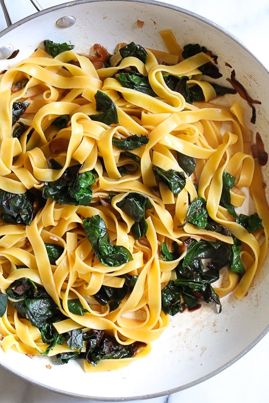 Pasta, greens and poached egg are one of my go-to, no-fuss weeknight combinations in the winter when I'm hungry and need dinner on the table quick. I always have eggs, pasta and some type of green vegetable on hand, for this I used Swiss chard, but spinach, escarole or kale would also work.
